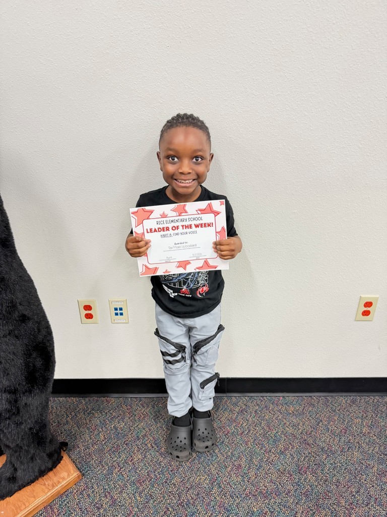 student holding a certificate