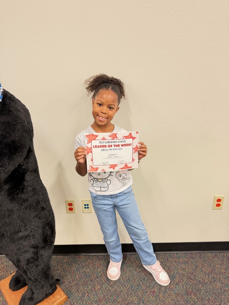 student holding a certificate