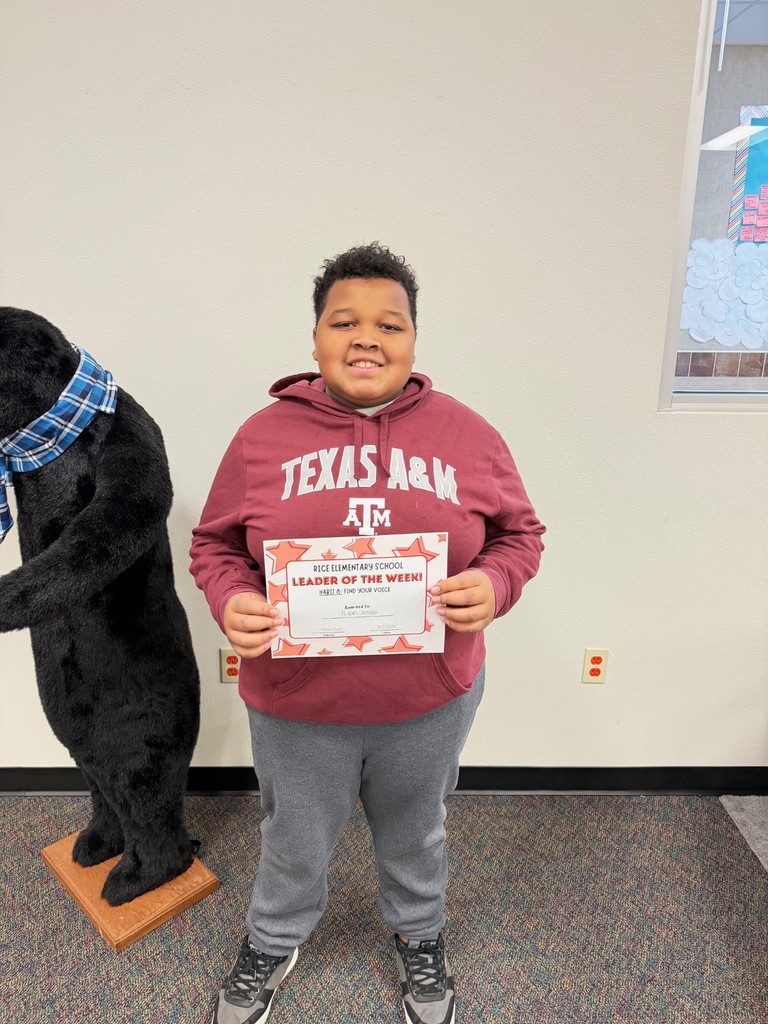 student holding a certificate