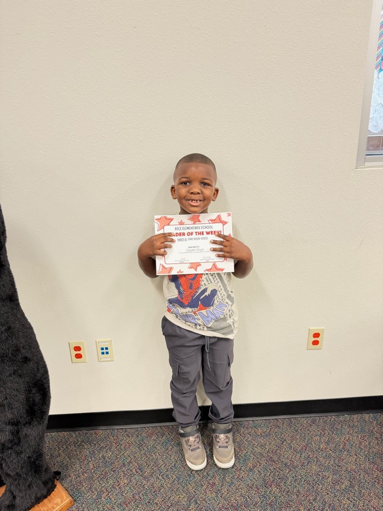 student holding a certificate