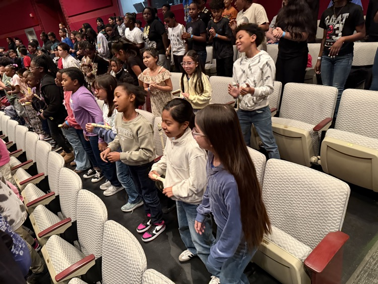 students smiling and singing