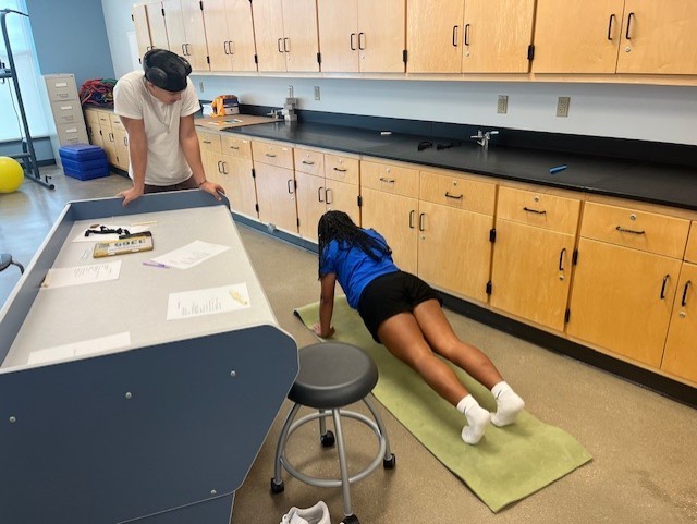 Students doing 60 second planks.