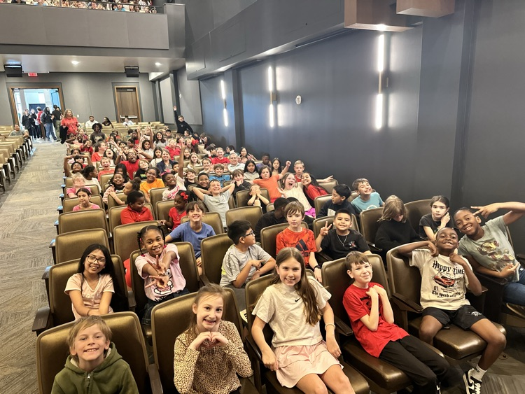 student sitting in the theater