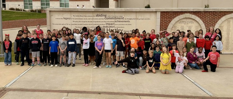 students standing outside the theater