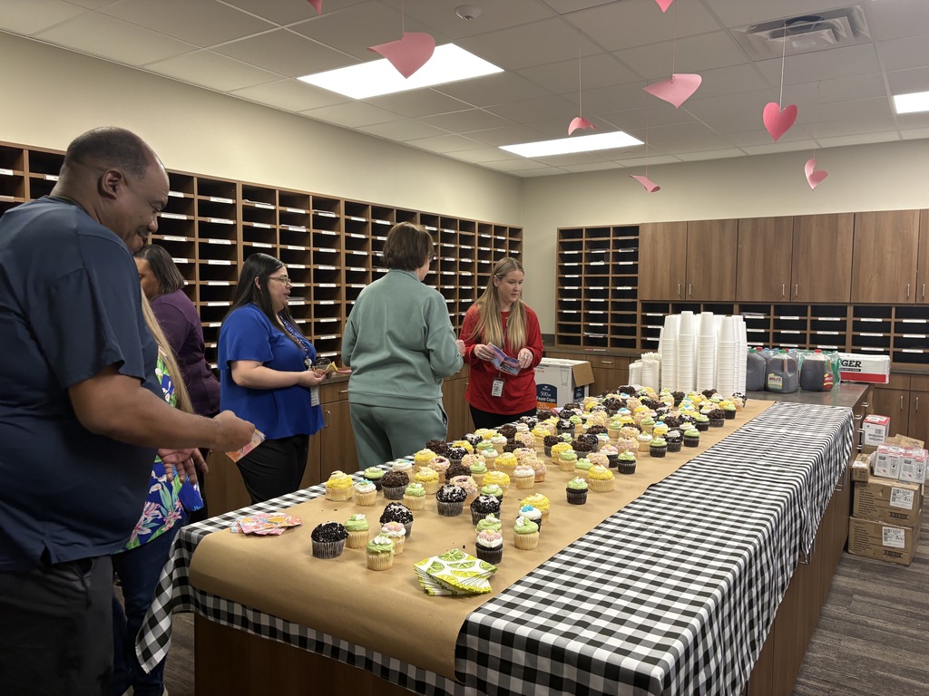 Tyler Legacy staff enjoying cupcakes from PTA