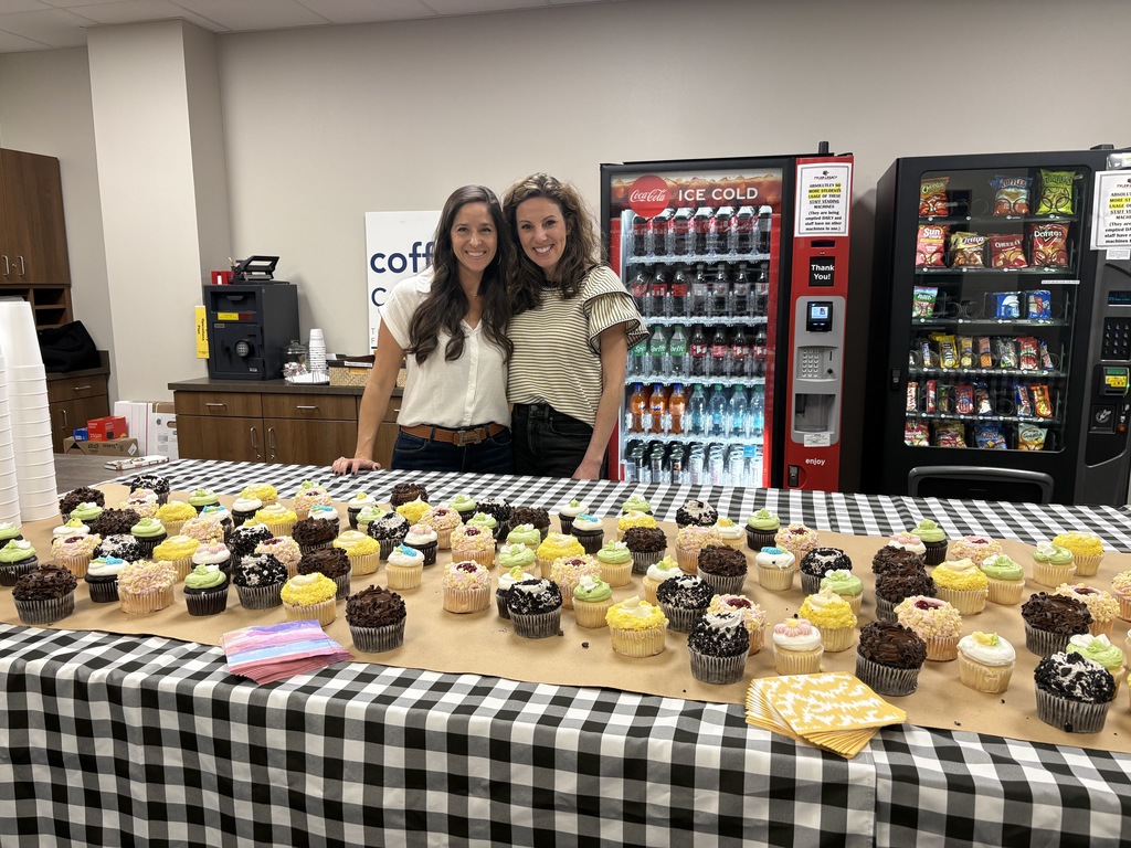 PTA posing with cupcakes
