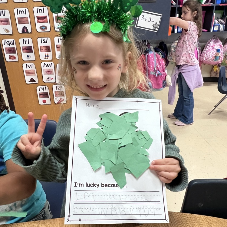 Student showing they’re lucky writing