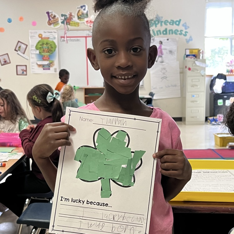 Student showing they’re lucky writing