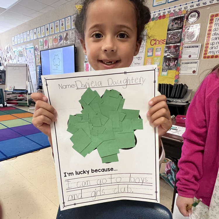 Student showing they’re lucky writing