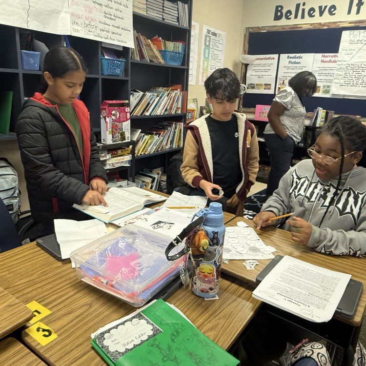 students working collaboratively on hexagonal activity
