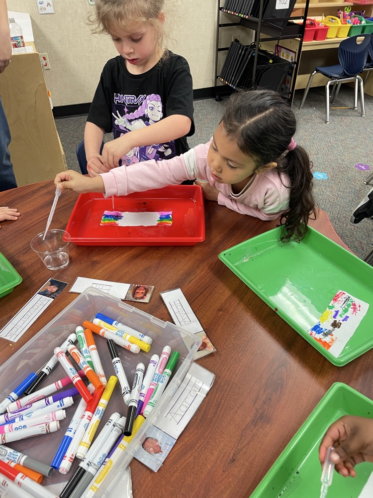 A kid doing rainbow activities. 