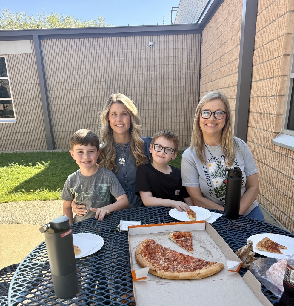 Students with principal and teacher celebrating finishing sight word books.