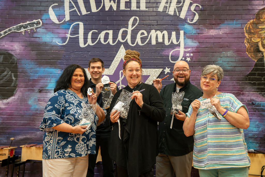 Caldwell Music Teachers smile and hold the WSL appreciation goodie bag.