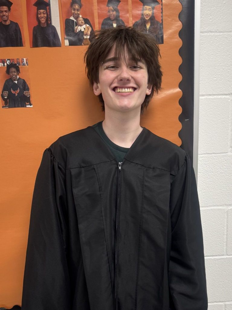 Student posing in graduation regalia