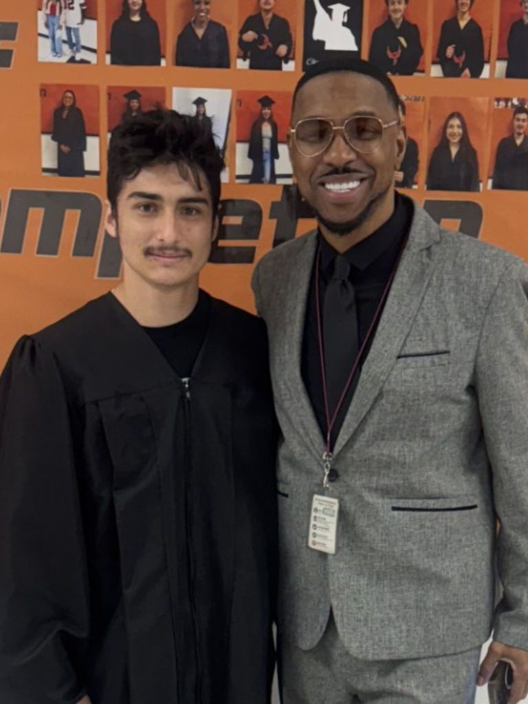 students posing with principal