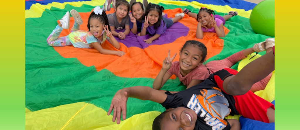 kids playing on a parachute