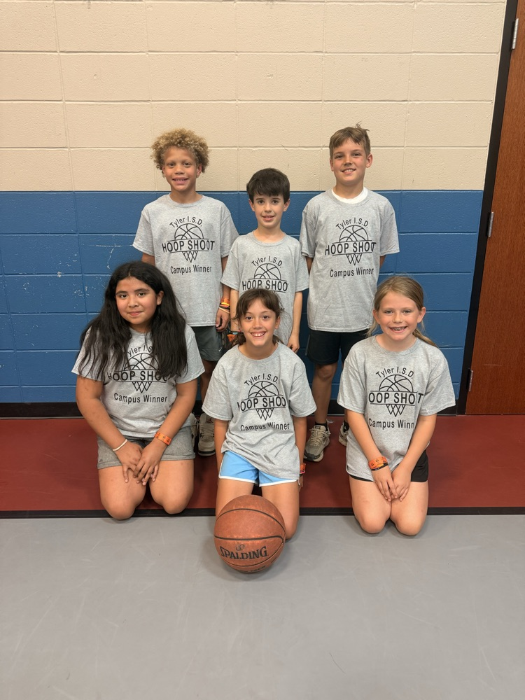 6 students in the gym with a basketball.