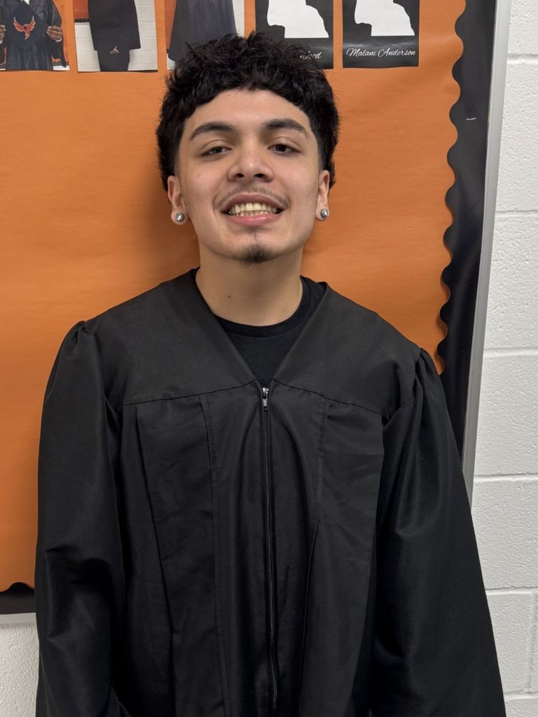 Student posing in graduation regalia