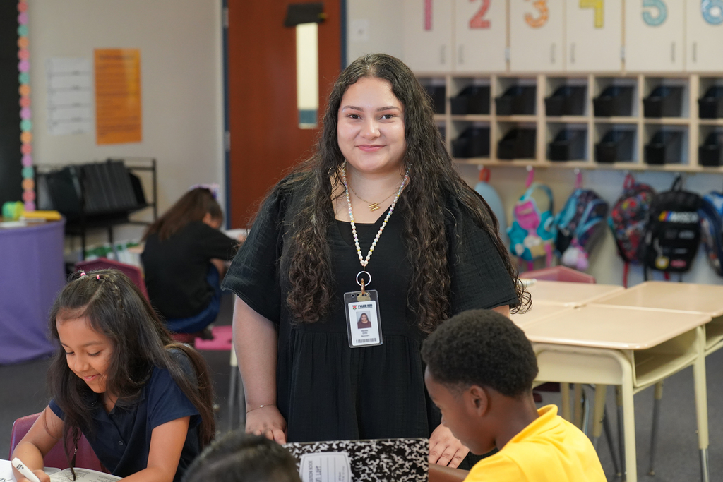 Tyler ISD Paraprofessional smile in classroom.