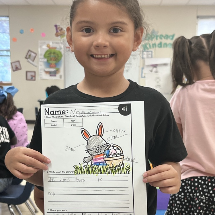 spring writing math activity. students holding up paper