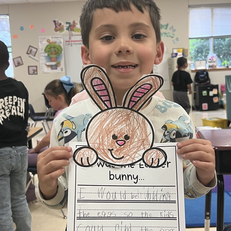 spring writing math activity. students holding up paper