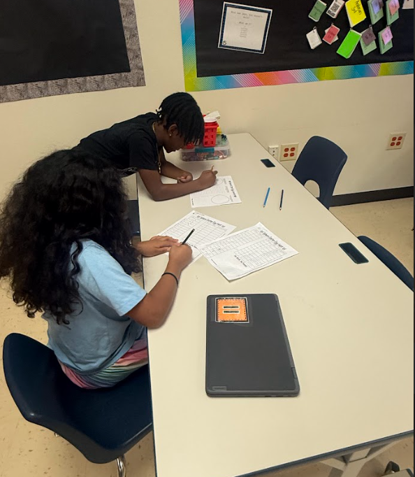 students completing math at tables