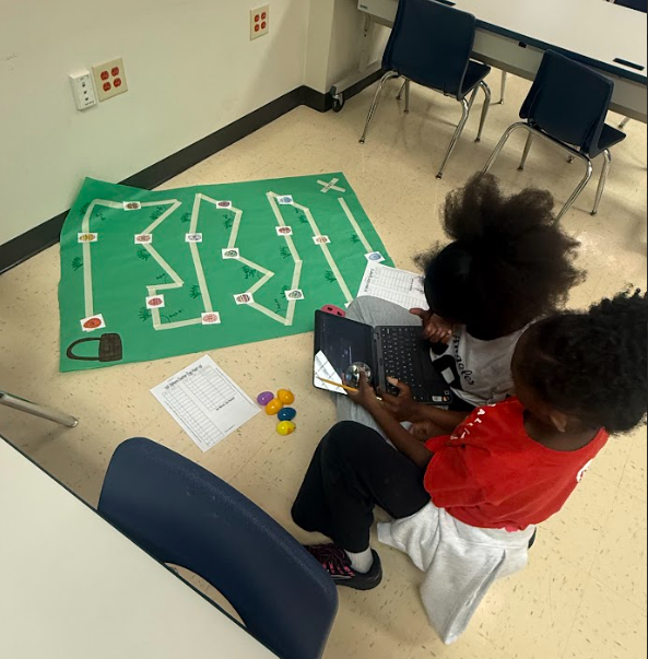 students coding robot to navigate down a path