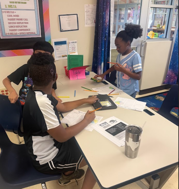 students completing math at tables