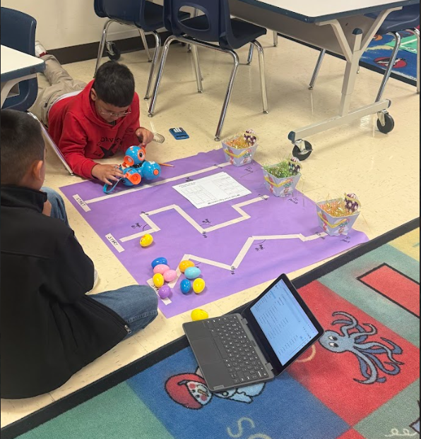 students coding robot to navigate down a path