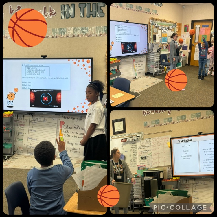 students playing trashketball. students working in groups and holding answer choice cards