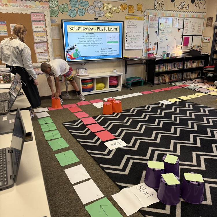 students playing life size sorry game reviewing for test 