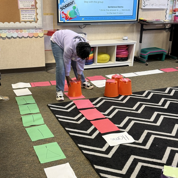 students playing life size sorry game reviewing for test 