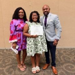 people posing with certificates