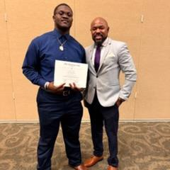 people posing with certificates