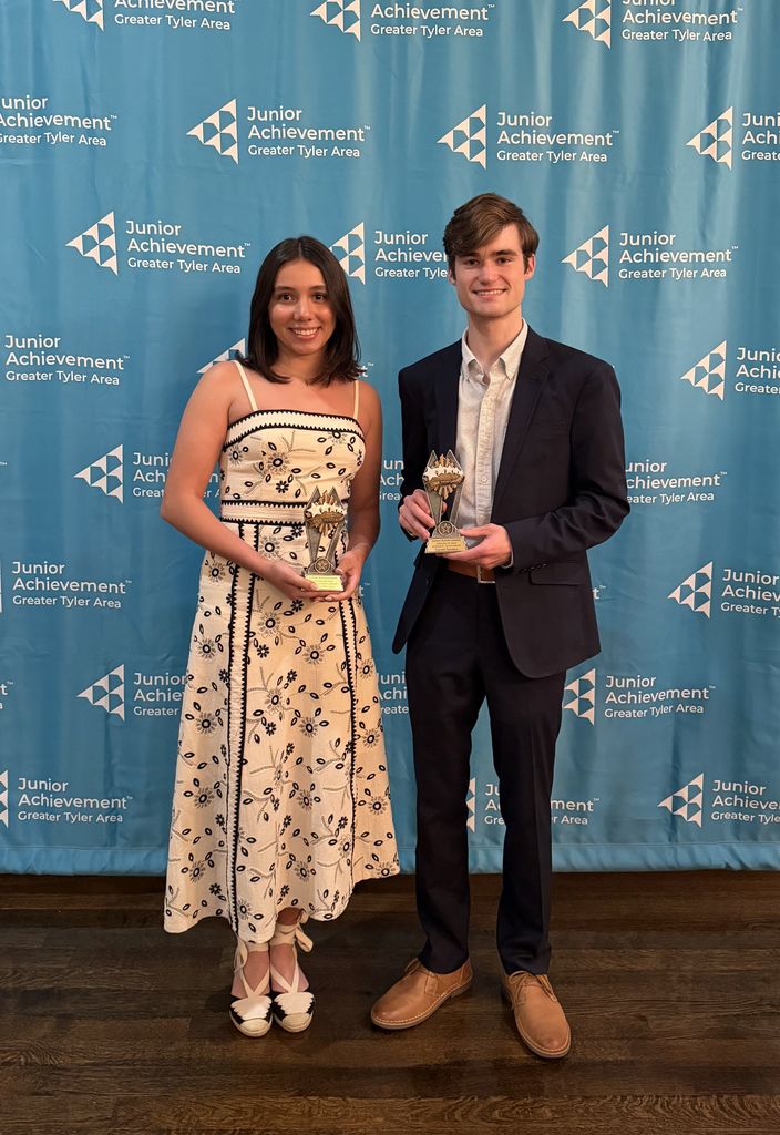 Tyler Legacy seniors Martina Moreno and Garrett Sanders with their JA student of the Year awards