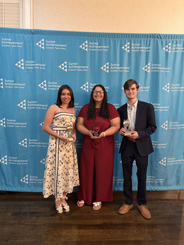 Tyler Legacy seniors Martina Moreno and Garrett Sanders with their JA student of the Year awards and Mrs. Morrow with her volunteer of the year award