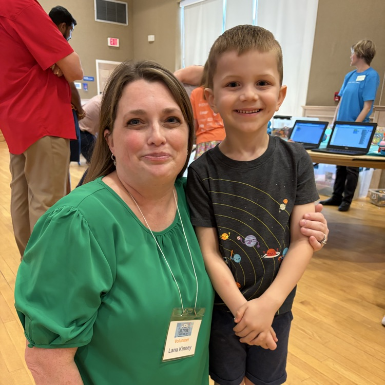Teacher posing with student