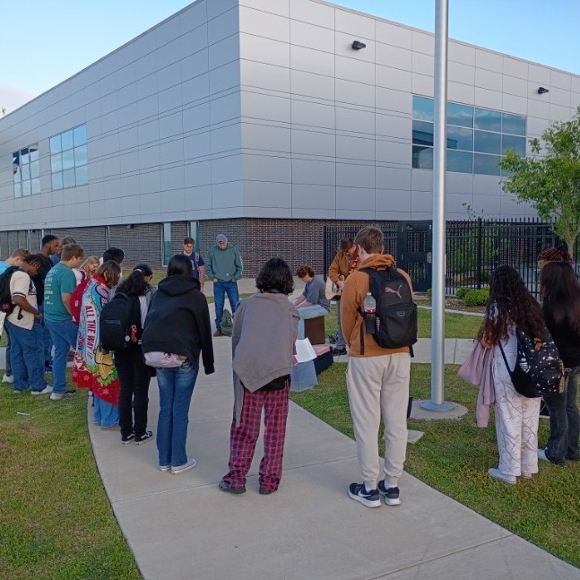 ECHS students gathering to pray for students and the end of year testing.
