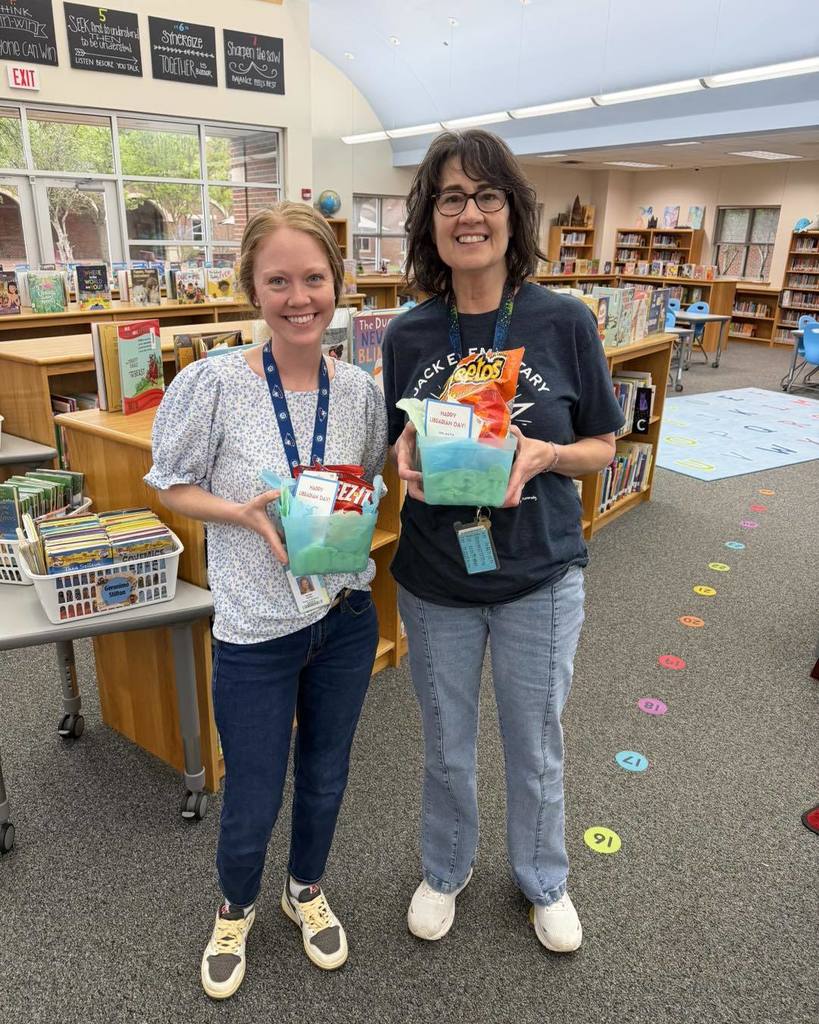 Jack Elementary Librarians smile while holding their appreciation baskets.