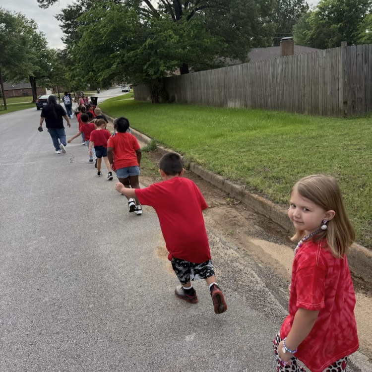 pre k students walking down the street