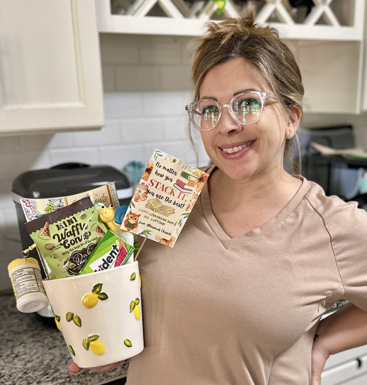 Mrs. Lupton holding her gift basket
