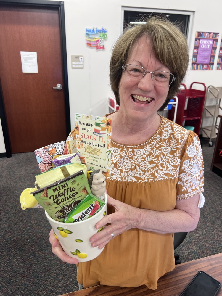 Mrs. Stegall holding her gift basket  