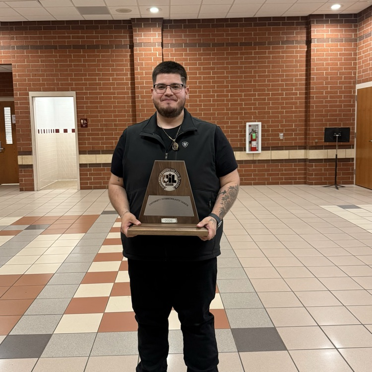 man holding a trophy