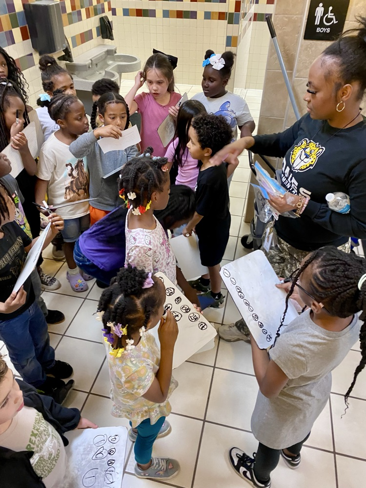 students listening to student read a clue