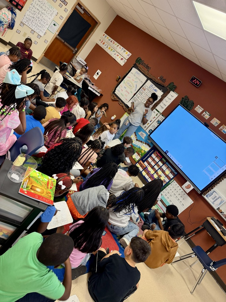 students listening to teacher talk