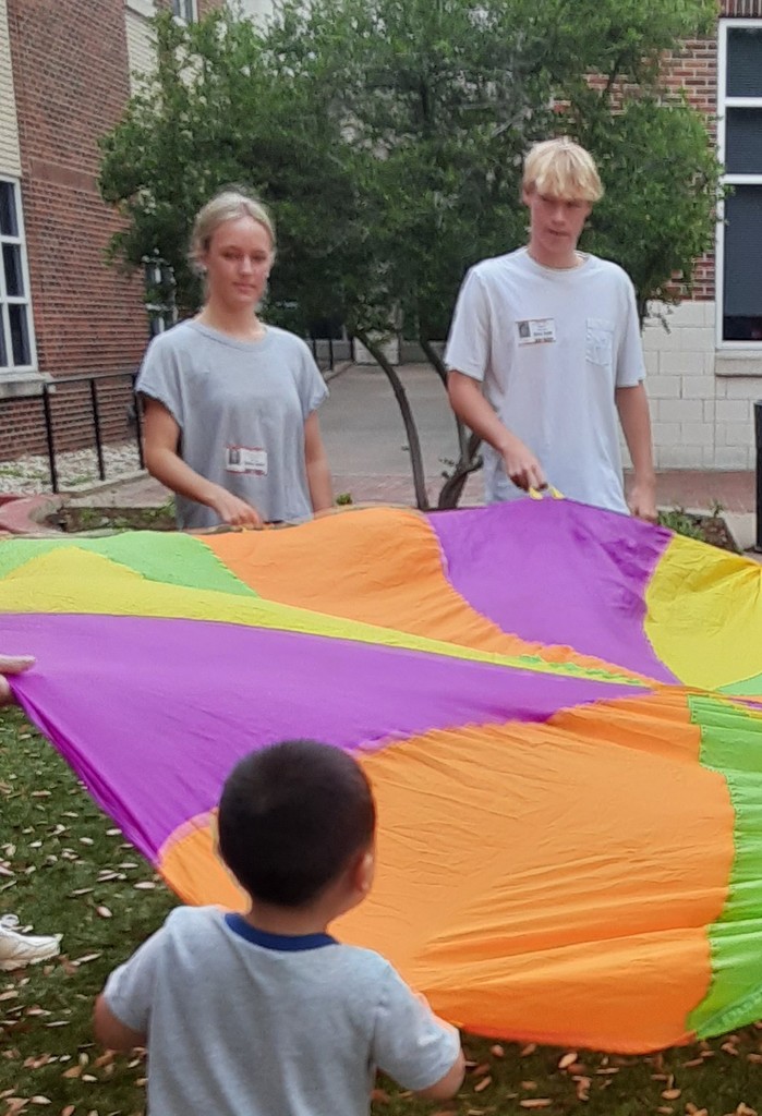 Kids using a parachute