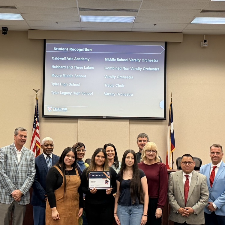students holding certificates 