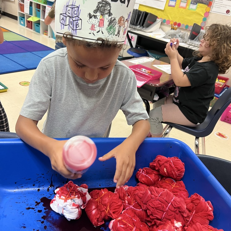 student dying a shirt red