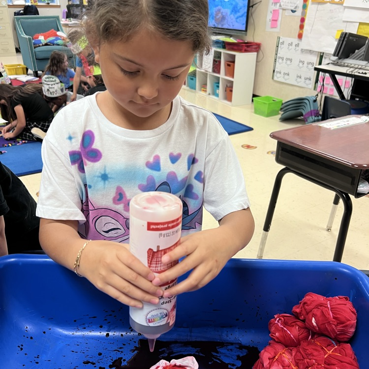 student dying a shirt red
