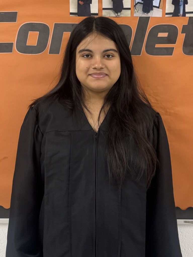 Student posing in graduation regalia